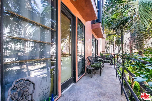 a spacious bedroom with a bed and a window