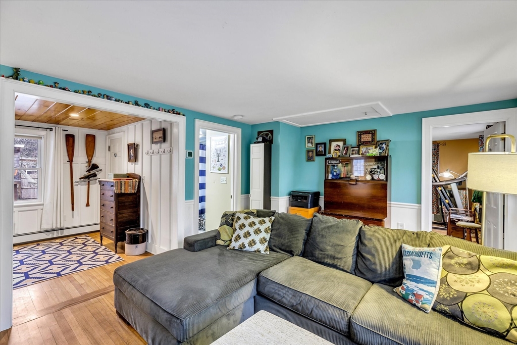 34 Weir Road Yarmouth, MA 02675 - Photo 11 of 39 a living room with furniture and a wooden floor