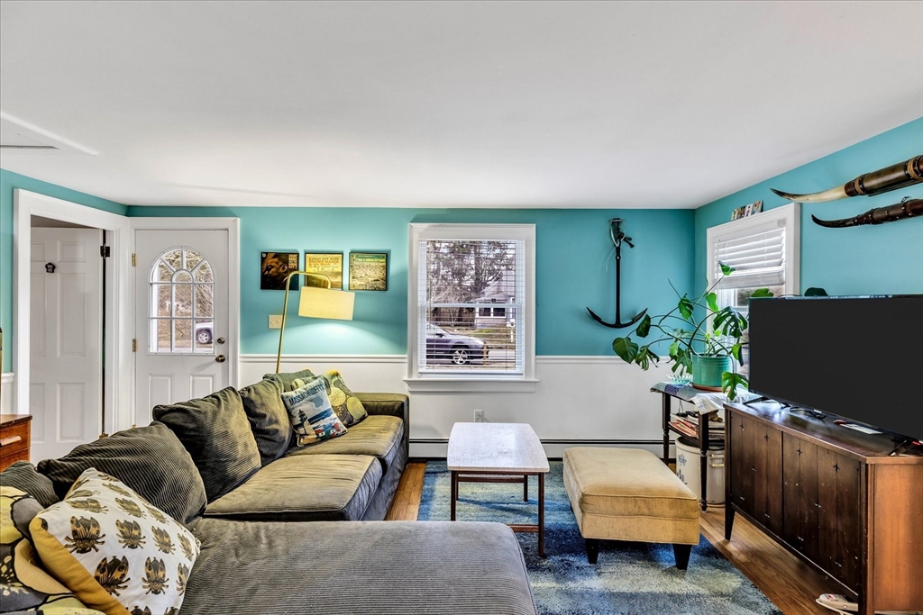 34 Weir Road Yarmouth, MA 02675 - Photo 12 of 39 a living room with furniture and a flat screen tv