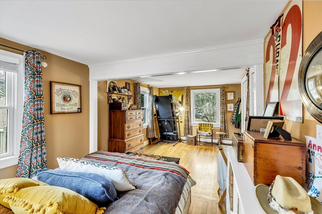 34 Weir Road Yarmouth, MA 02675 - Photo 19 of 39 a bed sitting in a bedroom next to a window