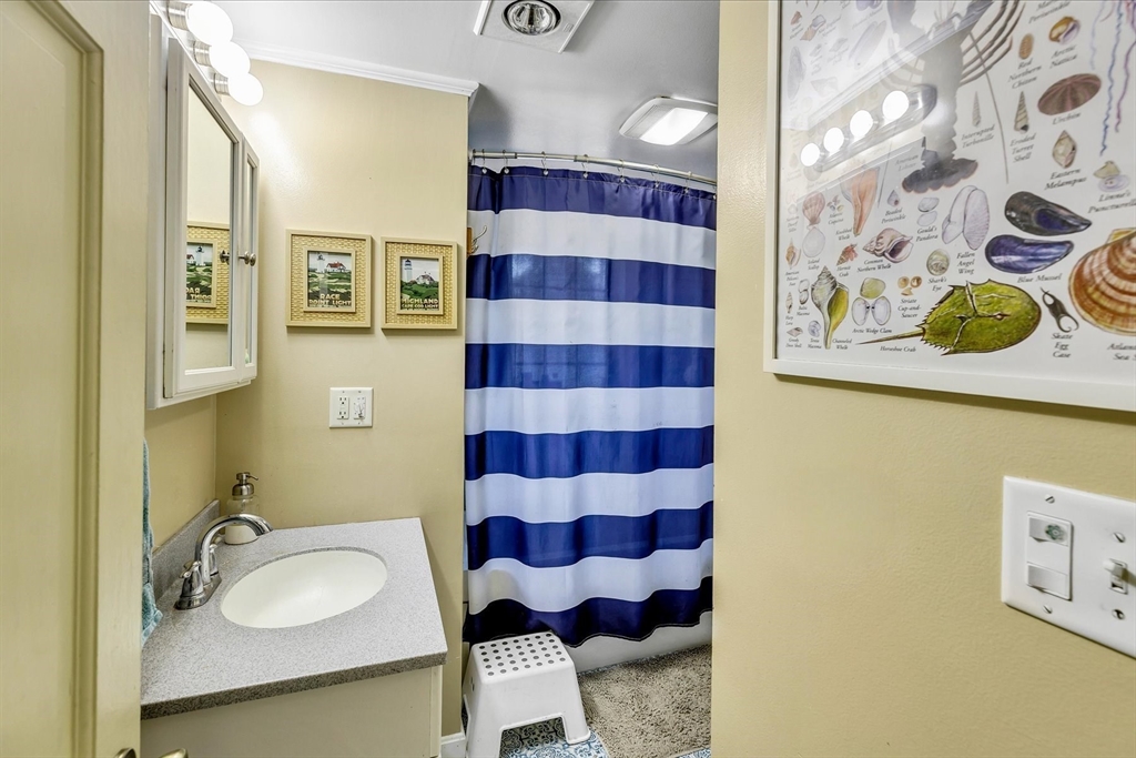 34 Weir Road Yarmouth, MA 02675 - Photo 20 of 39 a bathroom with a sink toilet and shower