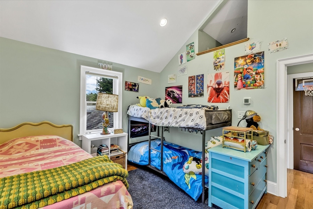 34 Weir Road Yarmouth, MA 02675 - Photo 25 of 39 a bedroom with a bed and wooden floor