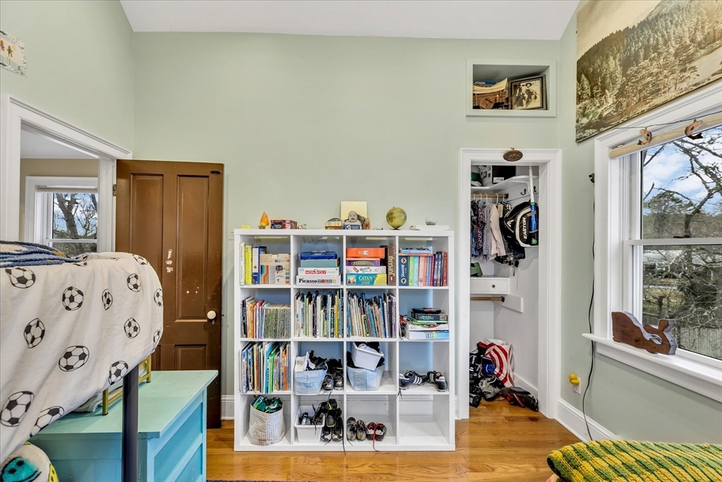 34 Weir Road Yarmouth, MA 02675 - Photo 26 of 39 a bedroom with furniture and a book shelf