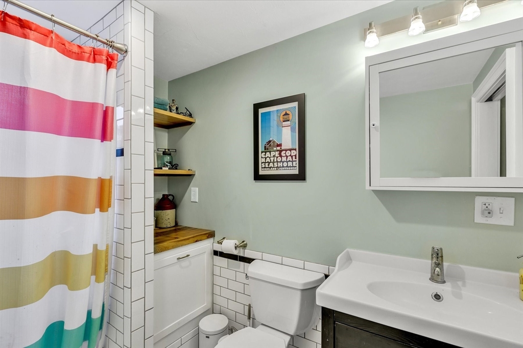 34 Weir Road Yarmouth, MA 02675 - Photo 27 of 39 a bathroom with a sink toilet and mirror