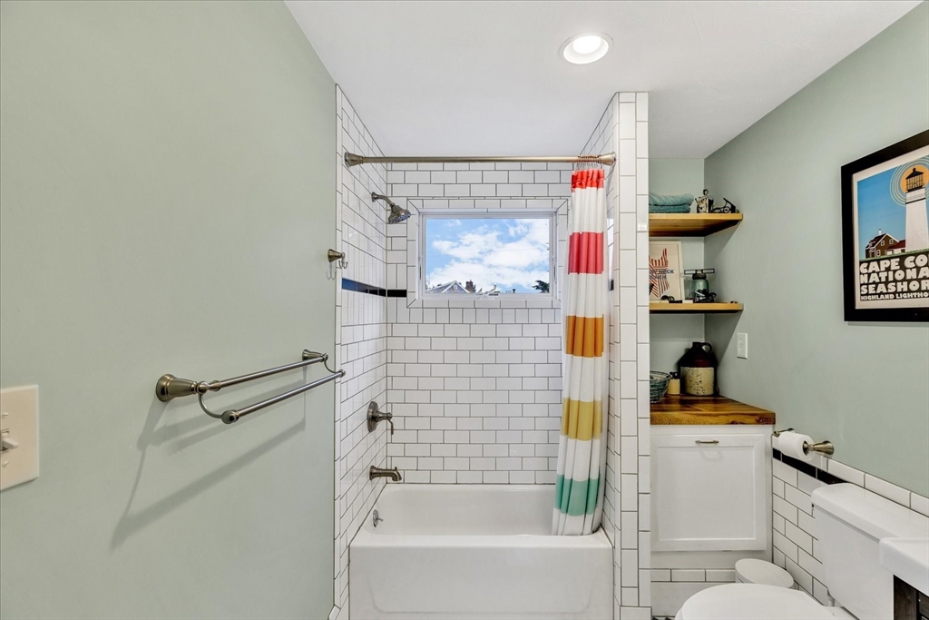 34 Weir Road Yarmouth, MA 02675 - Photo 28 of 39 a bathroom with a bathtub and a shower