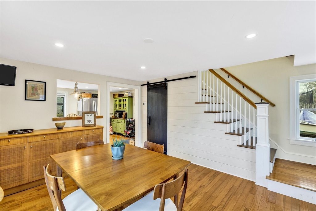 34 Weir Road Yarmouth, MA 02675 - Photo 3 of 39 a view of a dining room with furniture a potted plant and wooden floor