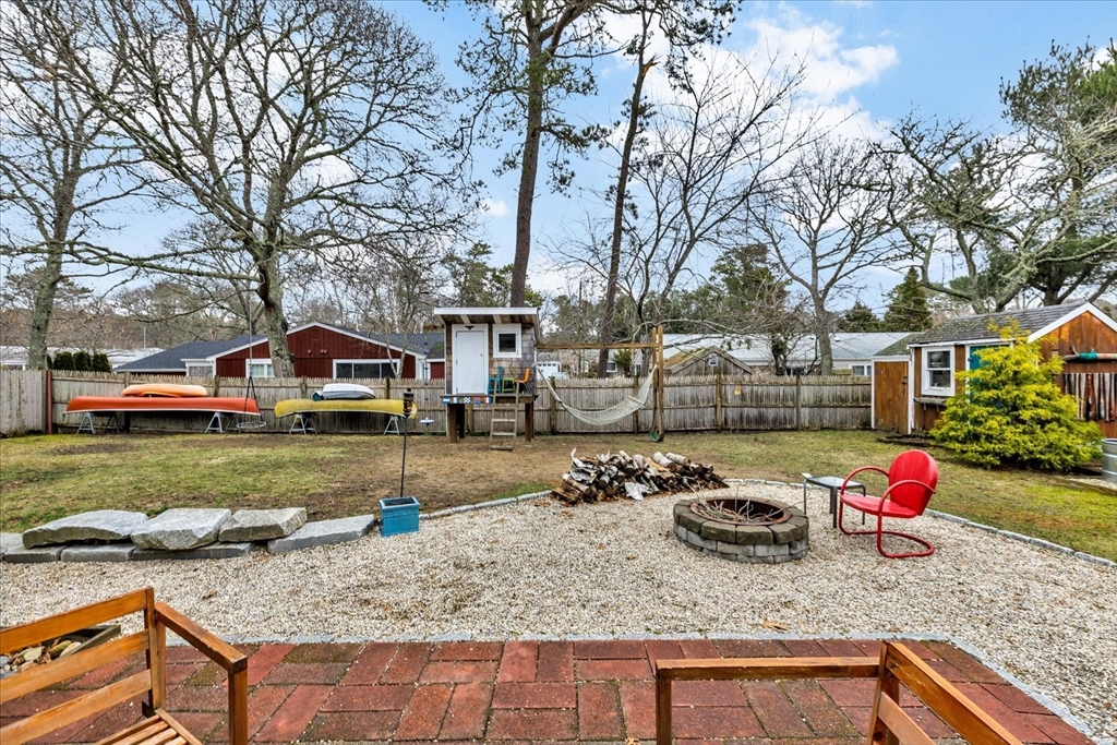 34 Weir Road Yarmouth, MA 02675 - Photo 34 of 39 a front view of a house with garden
