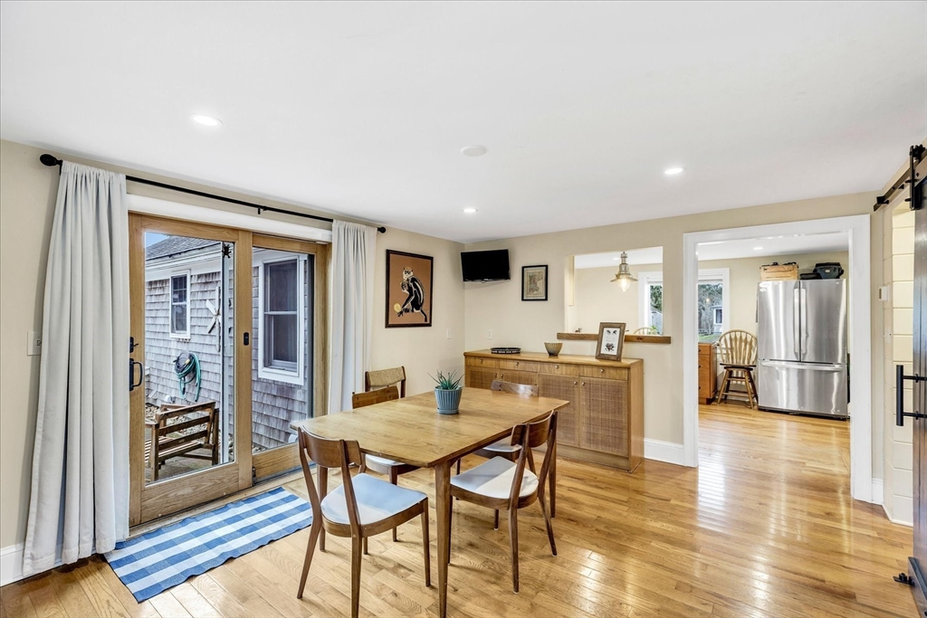 34 Weir Road Yarmouth, MA 02675 - Photo 5 of 39 a view of a dining room with furniture and wooden floor