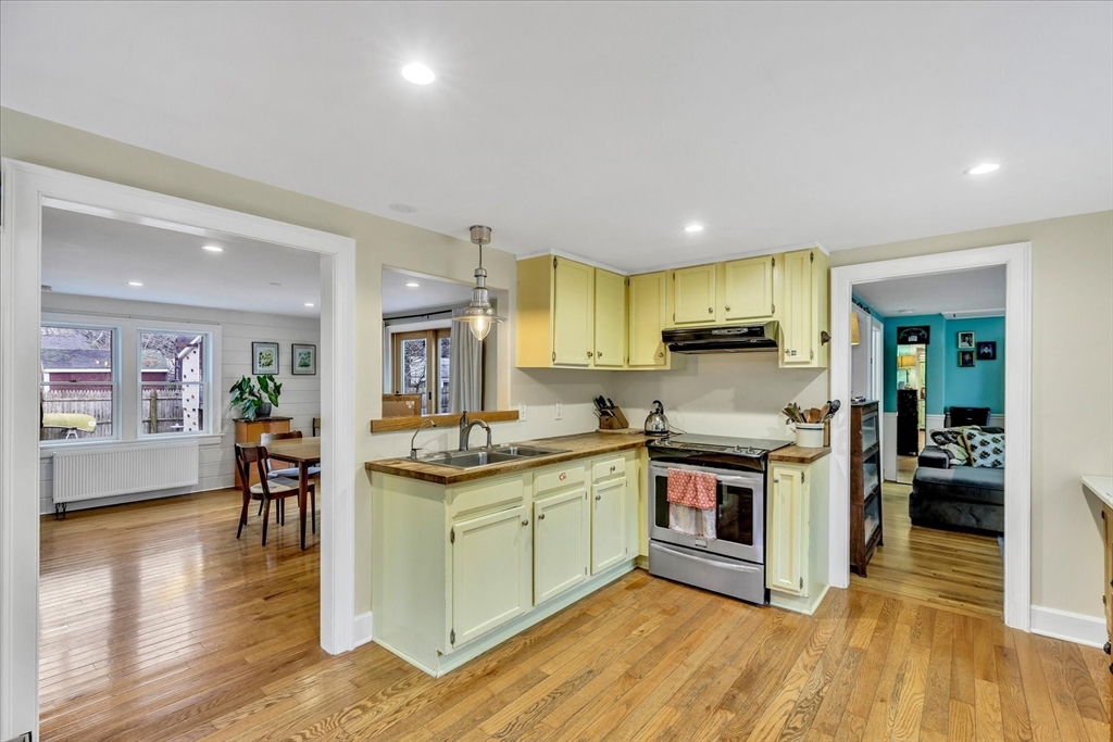 34 Weir Road Yarmouth, MA 02675 - Photo 6 of 39 a kitchen with stainless steel appliances granite countertop wooden floors and stove