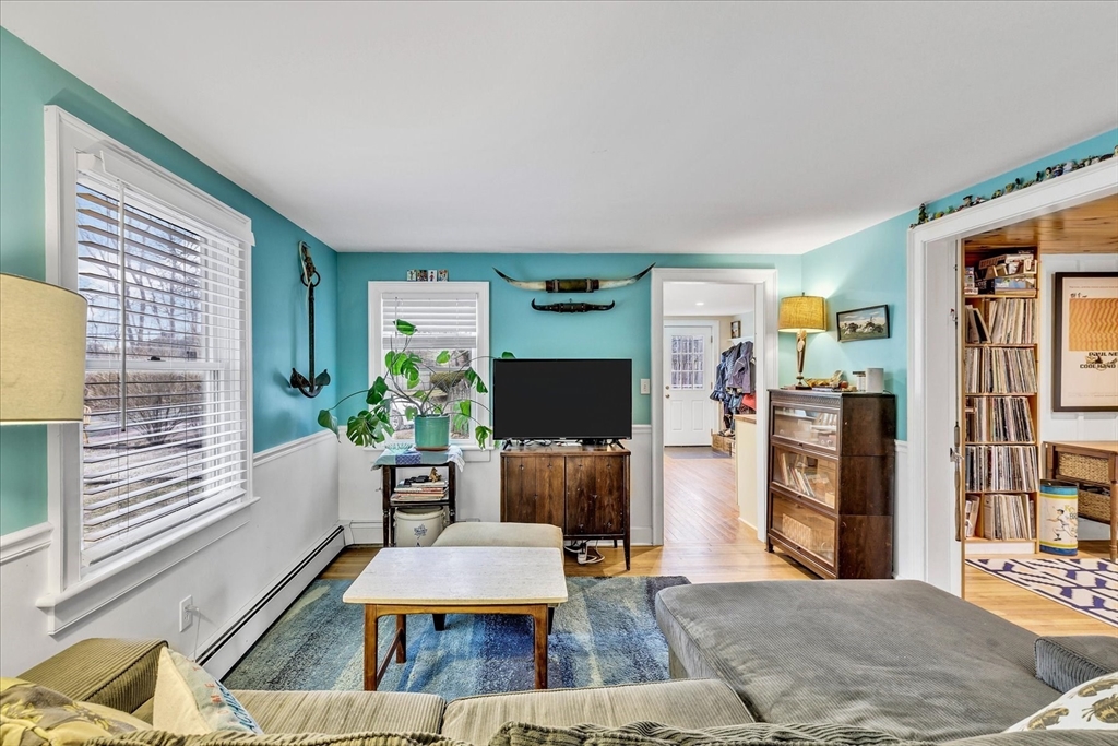 34 Weir Road Yarmouth, MA 02675 - Photo 10 of 39 a living room with furniture and a wooden floor