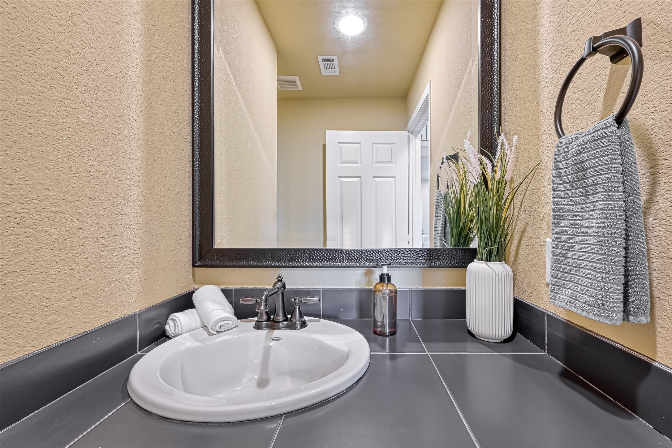 2102 Todville Road, Unit 9 Seabrook, TX 77586 - Photo 14 of 45 a bathroom with a sink and a mirror