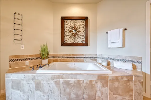 a bathroom with a tub and sink
