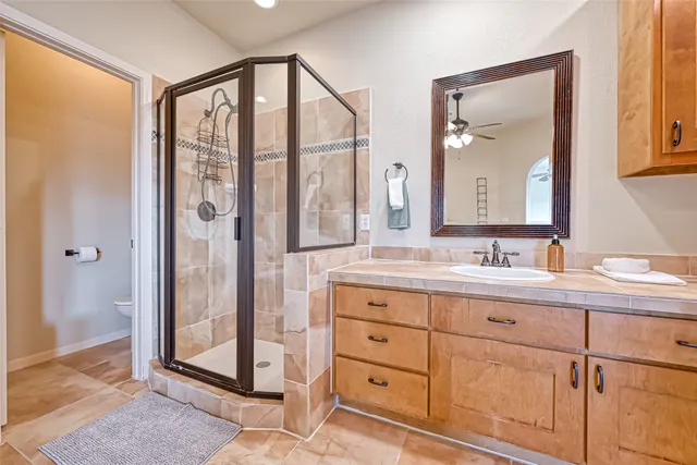 a bathroom with a double vanity sink and mirror