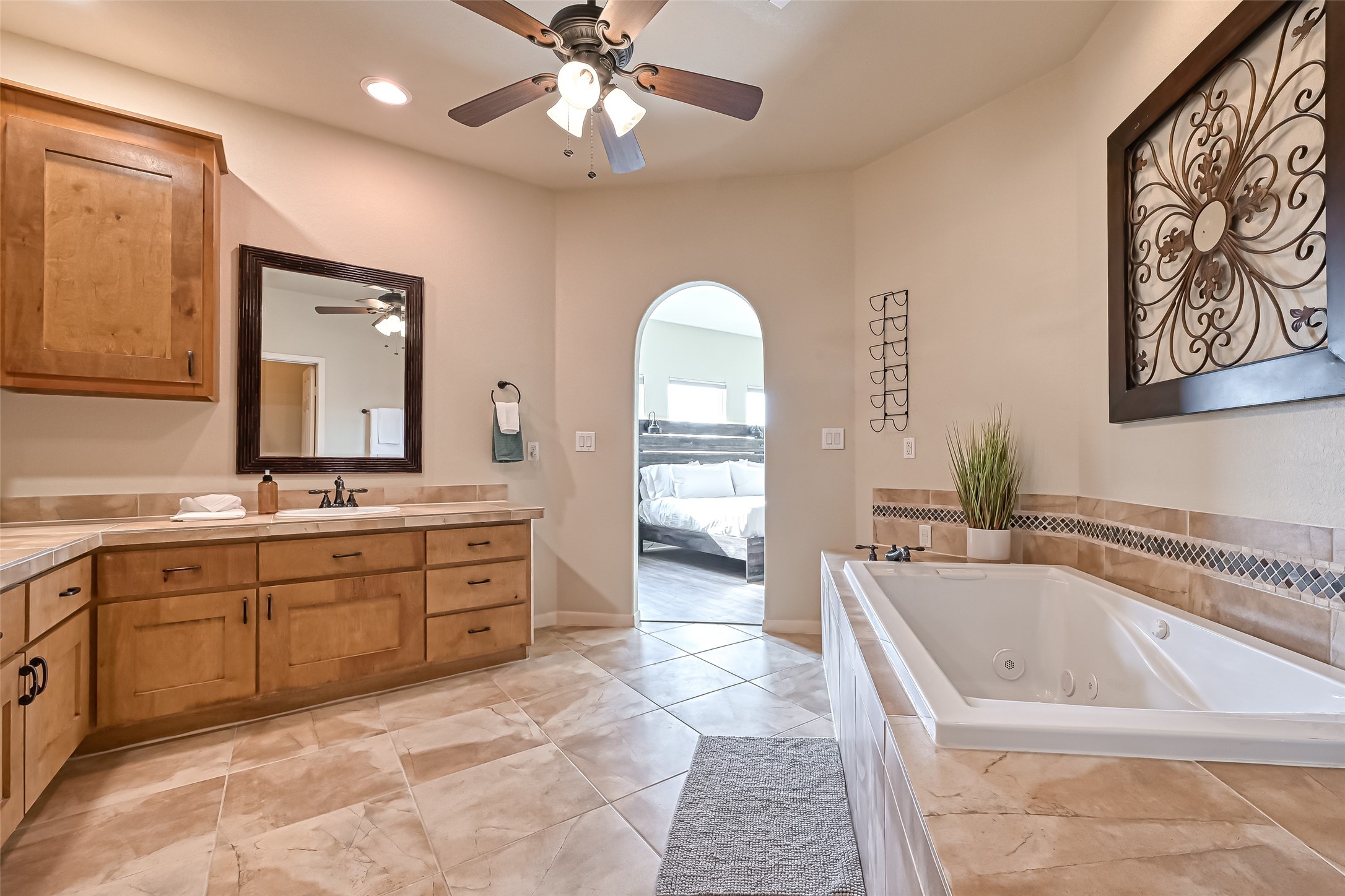 2102 Todville Road, Unit 9 Seabrook, TX 77586 - Photo 24 of 45 a spacious bathroom with a sink a large mirror and a bathtub