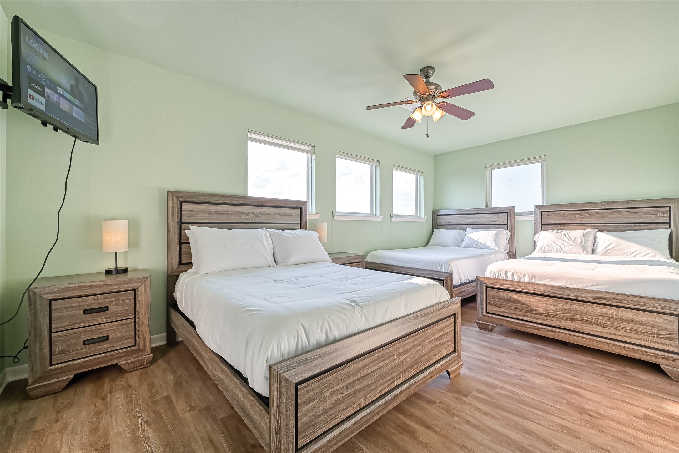 2102 Todville Road, Unit 9 Seabrook, TX 77586 - Photo 27 of 45 a bedroom with bed and a chandelier