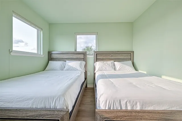 a bedroom with a bed and window