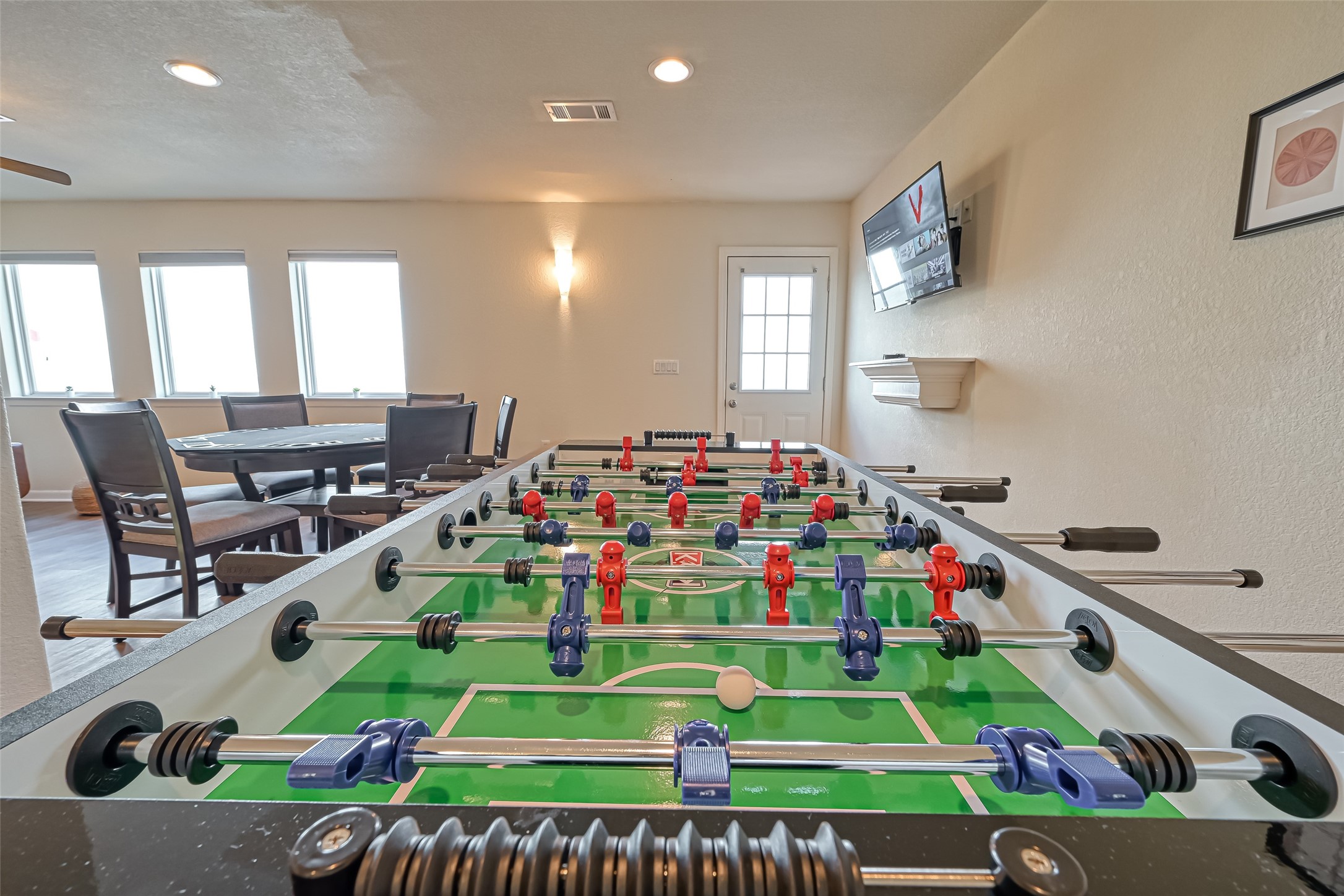 2102 Todville Road, Unit 9 Seabrook, TX 77586 - Photo 3 of 45 a room with lots of white furniture a baby crib and a wooden floor