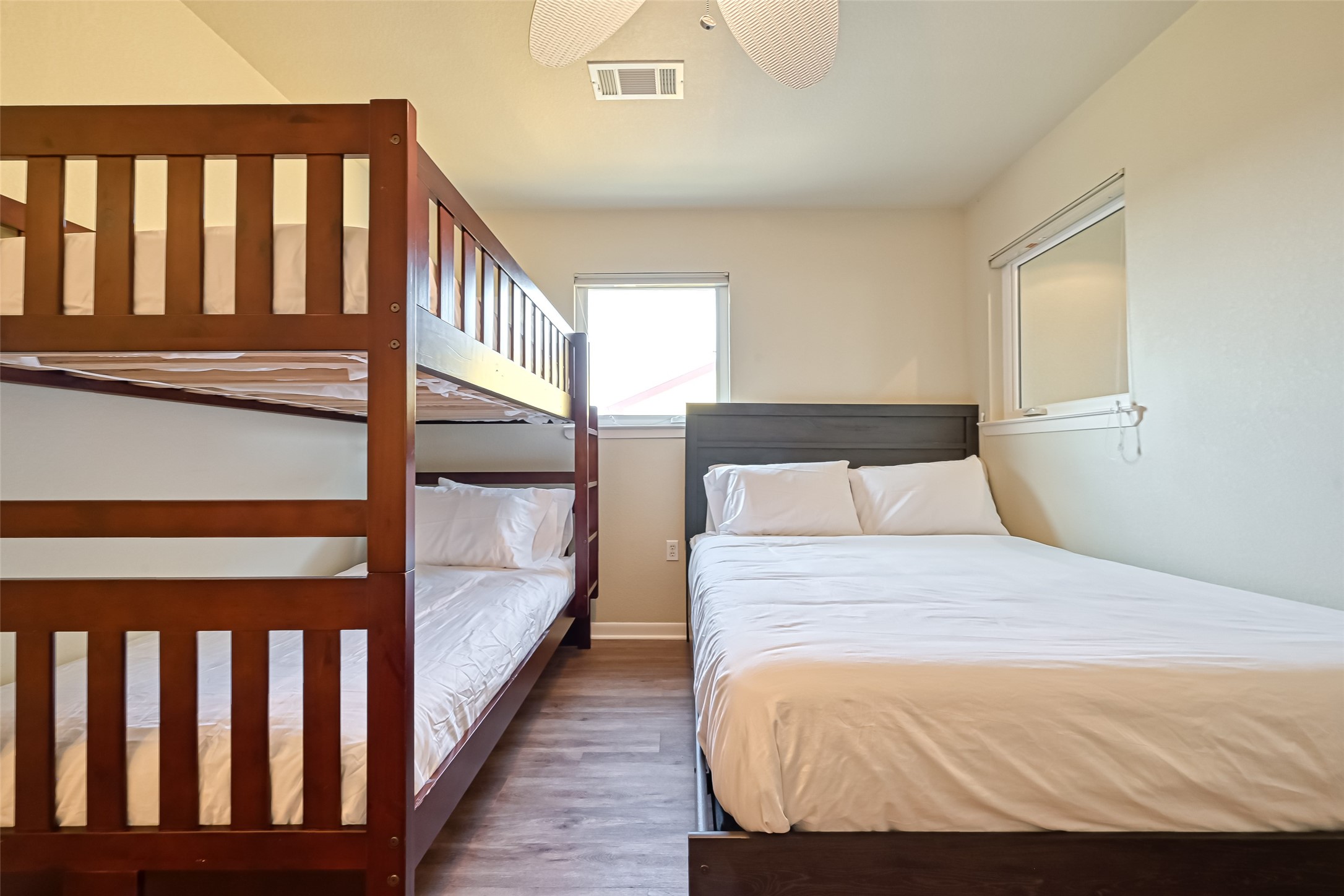 2102 Todville Road, Unit 9 Seabrook, TX 77586 - Photo 32 of 45 a bedroom with a bed and wooden floor