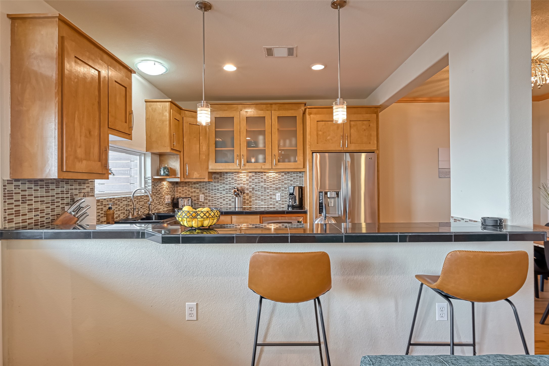 2102 Todville Road, Unit 9 Seabrook, TX 77586 - Photo 8 of 45 a kitchen with stainless steel appliances granite countertop a sink and a refrigerator