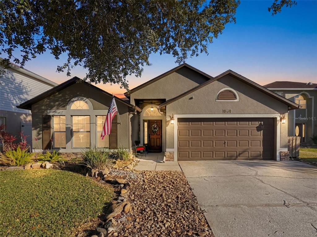 5407 Treig Lane Wesley Chapel, FL 33545 - Photo 1 of 70 a front view of a house with a yard
