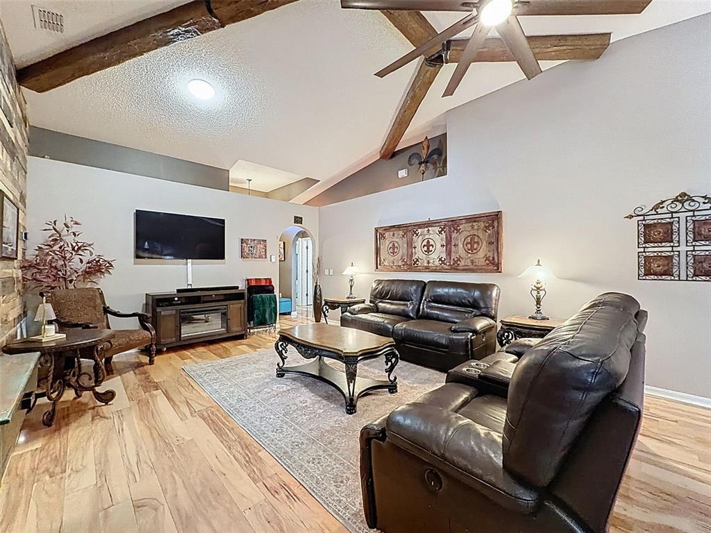 5407 Treig Lane Wesley Chapel, FL 33545 - Photo 11 of 70 a living room with furniture and a flat screen tv