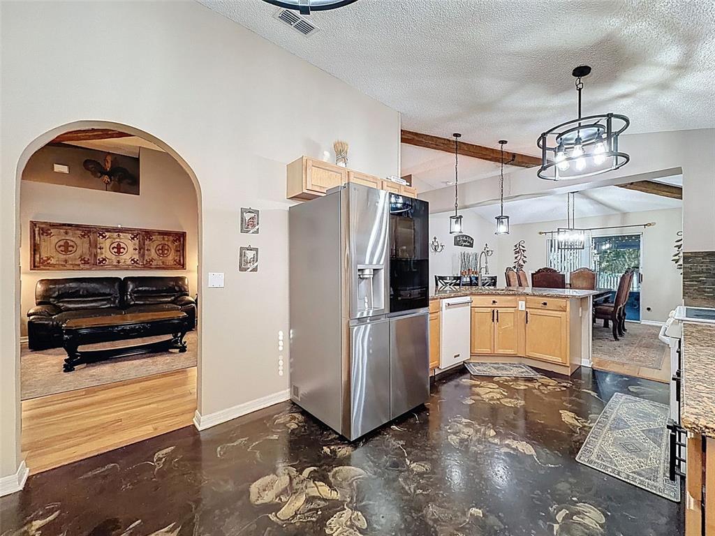 5407 Treig Lane Wesley Chapel, FL 33545 - Photo 12 of 70 a view of a kitchen stove and refrigerator