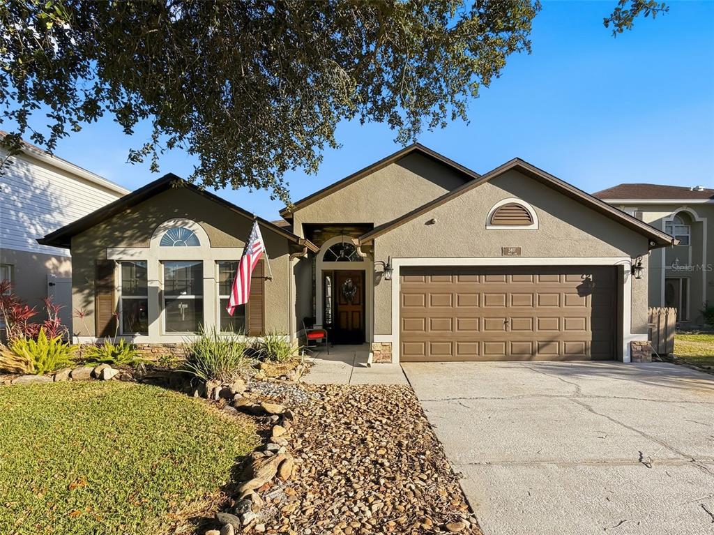 5407 Treig Lane Wesley Chapel, FL 33545 - Photo 2 of 70 a front view of a house with a yard