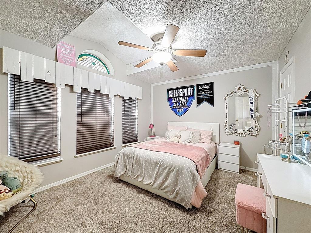 5407 Treig Lane Wesley Chapel, FL 33545 - Photo 31 of 70 a bedroom with a bed dresser and a window