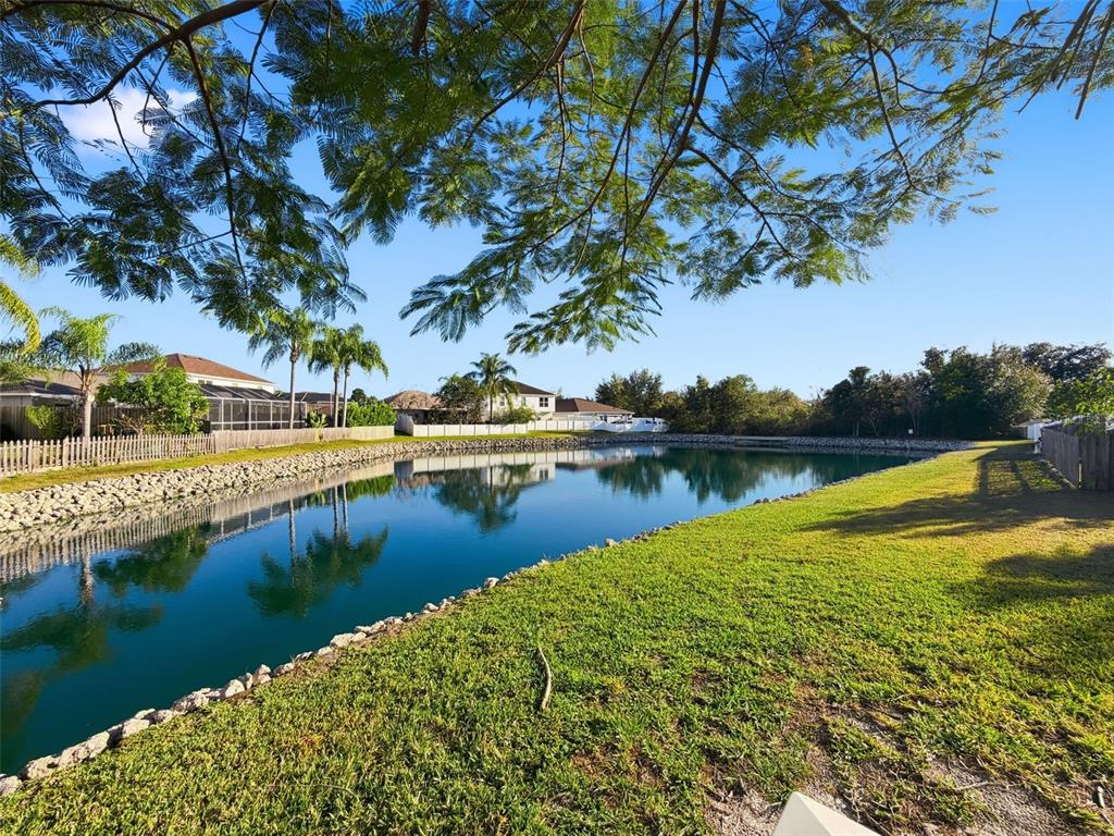5407 Treig Lane Wesley Chapel, FL 33545 - Photo 41 of 70 a view of a lake with houses with outdoor space