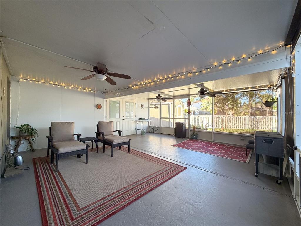 5407 Treig Lane Wesley Chapel, FL 33545 - Photo 50 of 70 a living room with furniture and a large window