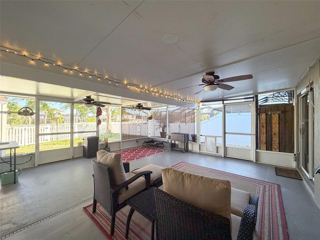 5407 Treig Lane Wesley Chapel, FL 33545 - Photo 53 of 70 a living room with furniture and a large window