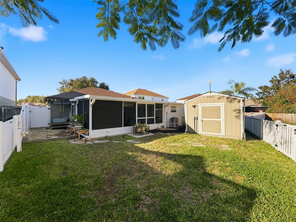 5407 Treig Lane Wesley Chapel, FL 33545 - Photo 54 of 70 a view of a house with a yard