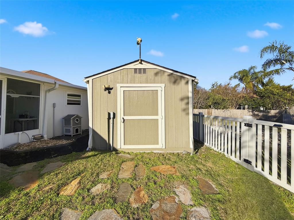5407 Treig Lane Wesley Chapel, FL 33545 - Photo 57 of 70 a front view of a house with a yard