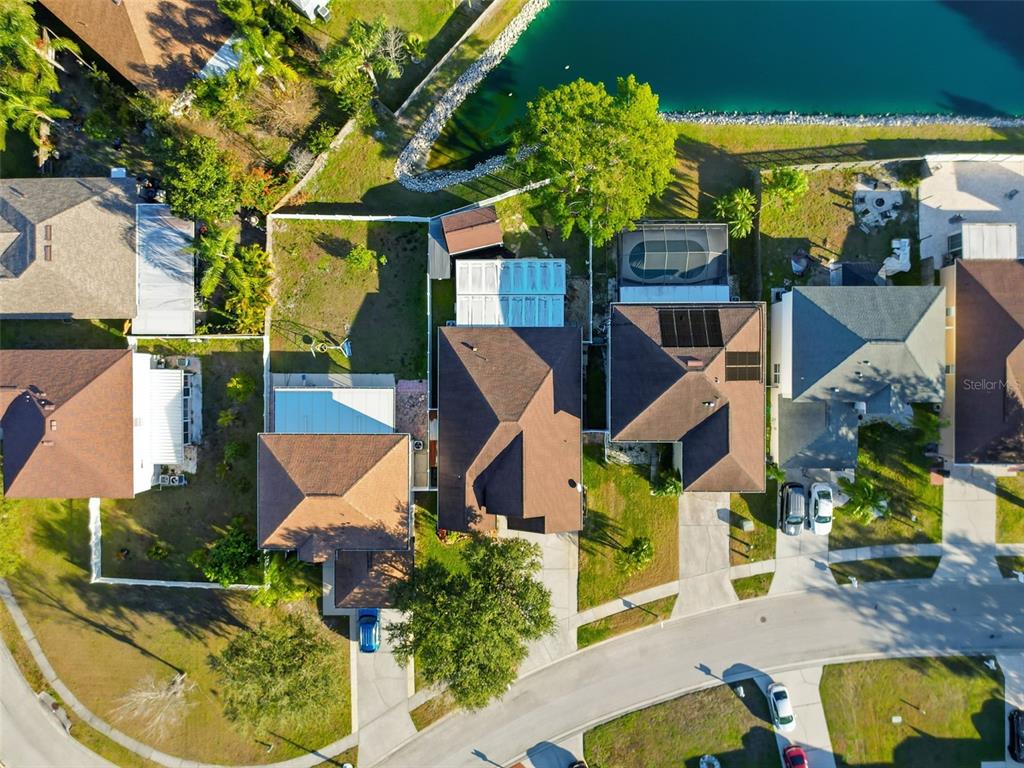 5407 Treig Lane Wesley Chapel, FL 33545 - Photo 60 of 70 an aerial view of a house with swimming pool and patio