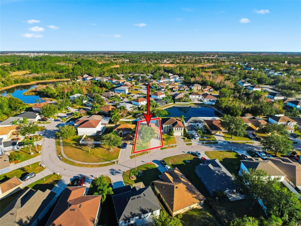 5407 Treig Lane Wesley Chapel, FL 33545 - Photo 62 of 70 an aerial view of residential houses with outdoor space