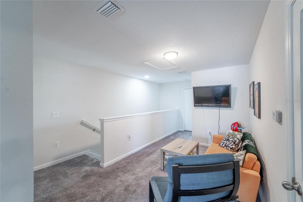 10908 Quickwater Court Riverview, FL 33569 - Photo 17 of 35 a room with furniture and white walls