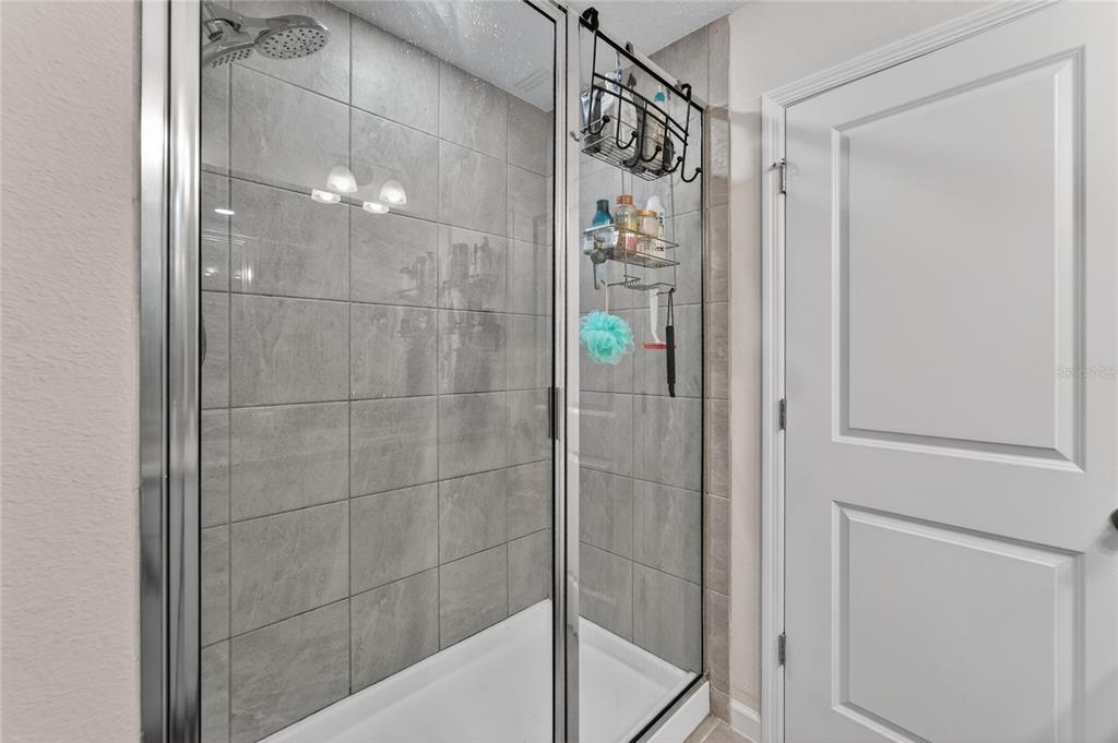 10908 Quickwater Court Riverview, FL 33569 - Photo 23 of 35 a bathroom with a shower and a sink