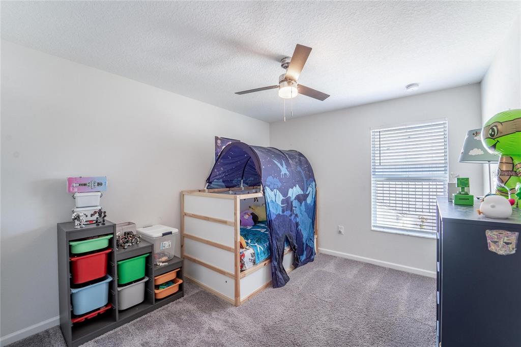10908 Quickwater Court Riverview, FL 33569 - Photo 24 of 35 a bed room with furniture and a window
