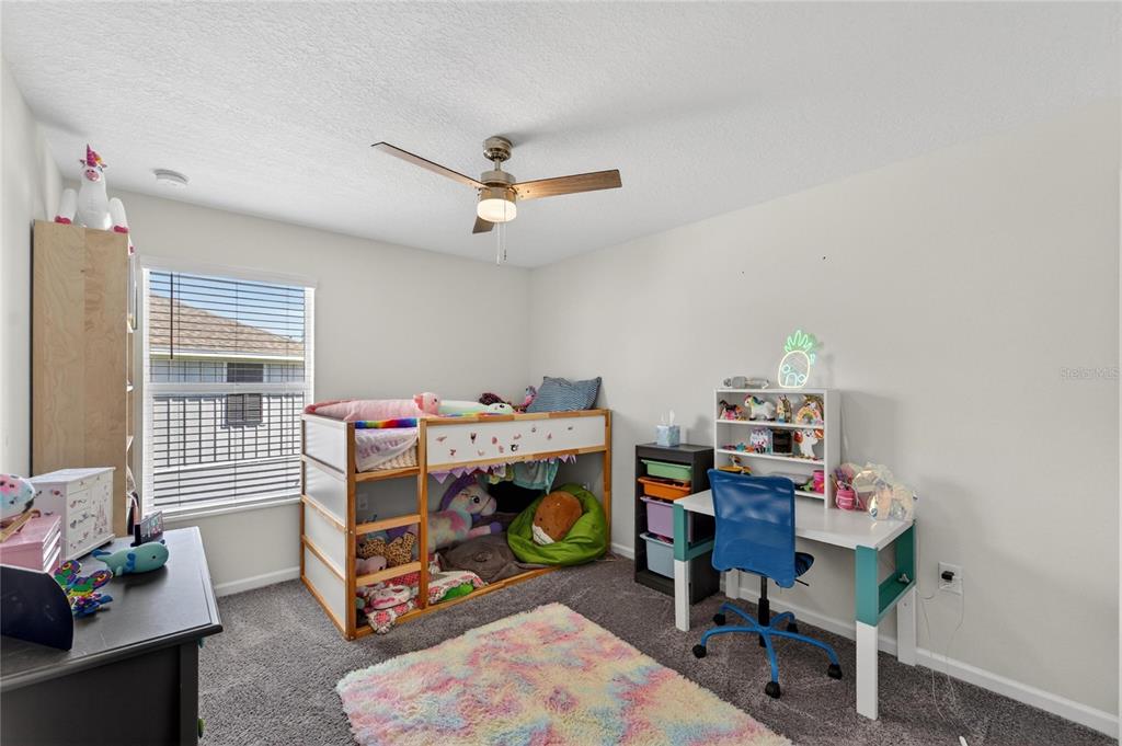 10908 Quickwater Court Riverview, FL 33569 - Photo 26 of 35 a view of a workspace with furniture and a window