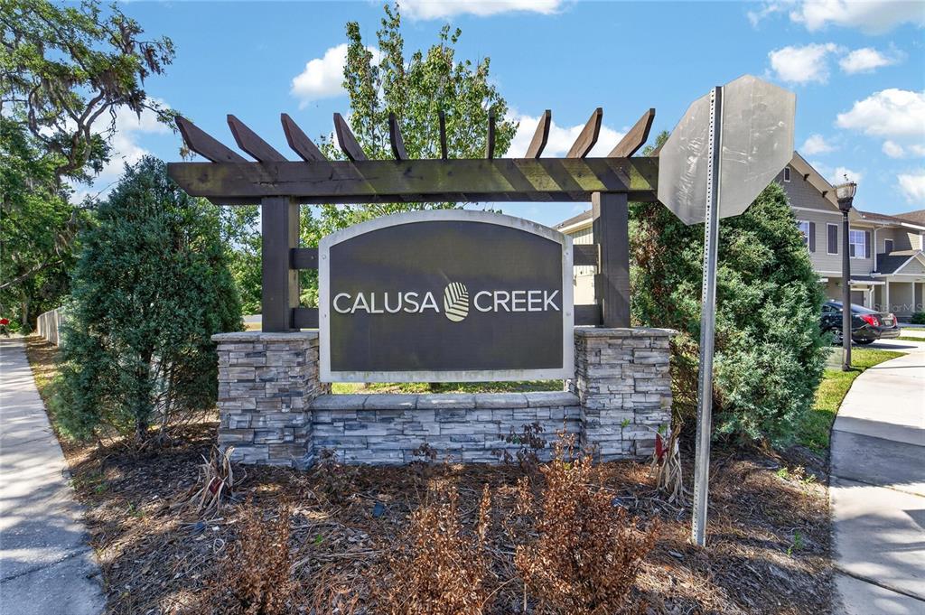 10908 Quickwater Court Riverview, FL 33569 - Photo 35 of 35 a sign that is sitting on a brick wall