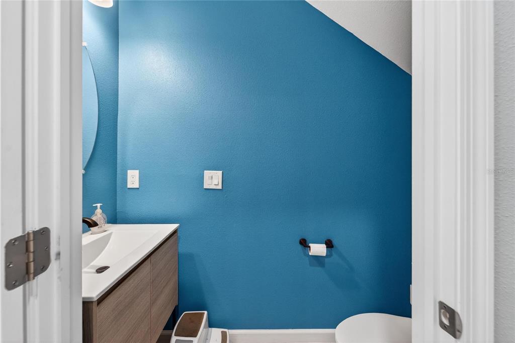10908 Quickwater Court Riverview, FL 33569 - Photo 8 of 35 a bathroom with a sink a toilet and mirror