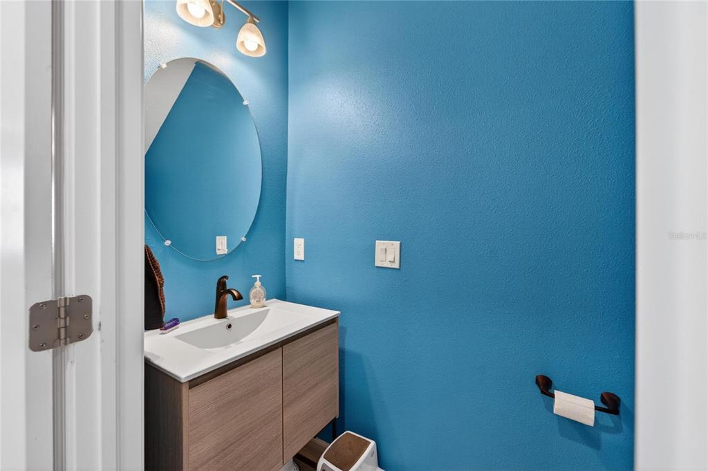 10908 Quickwater Court Riverview, FL 33569 - Photo 9 of 35 a bathroom with a sink and a mirror