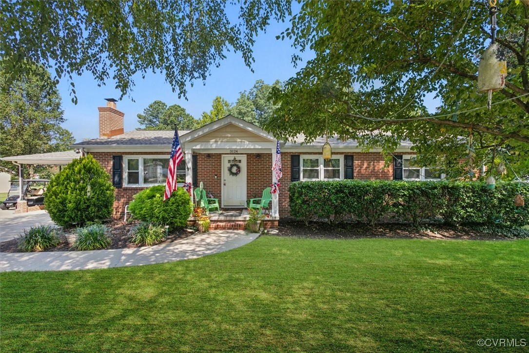 3124 North Riverside Drive Lanexa, VA 23089 - Photo 1 of 50 a front view of a house with a yard and porch
