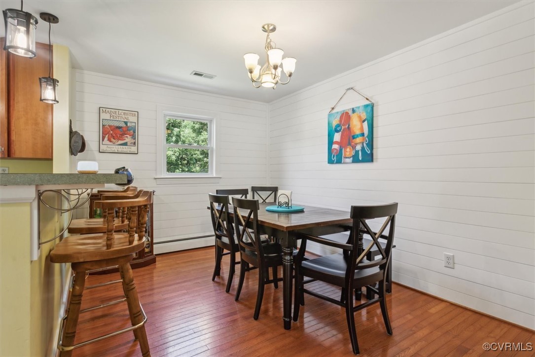 3124 North Riverside Drive Lanexa, VA 23089 - Photo 13 of 50 a view of a dining room with furniture wooden floor and a chandelier