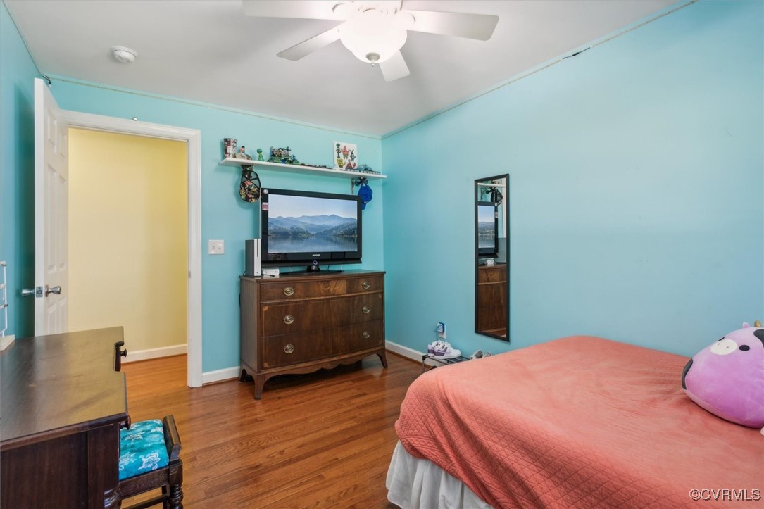 3124 North Riverside Drive Lanexa, VA 23089 - Photo 24 of 50 a bedroom with a bed and wooden floor