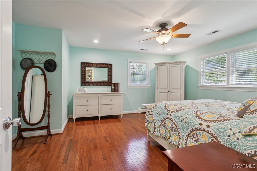 3124 North Riverside Drive Lanexa, VA 23089 - Photo 25 of 50 a bedroom with a bed and a chandelier