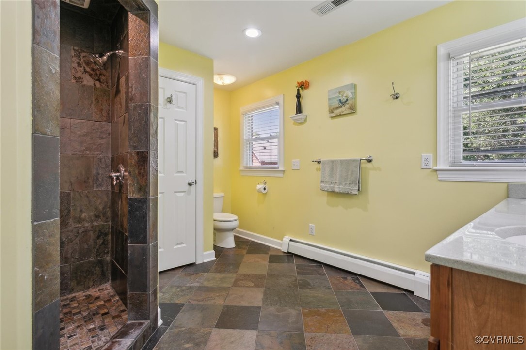 3124 North Riverside Drive Lanexa, VA 23089 - Photo 28 of 50 a bathroom with a granite countertop sink a toilet and shower