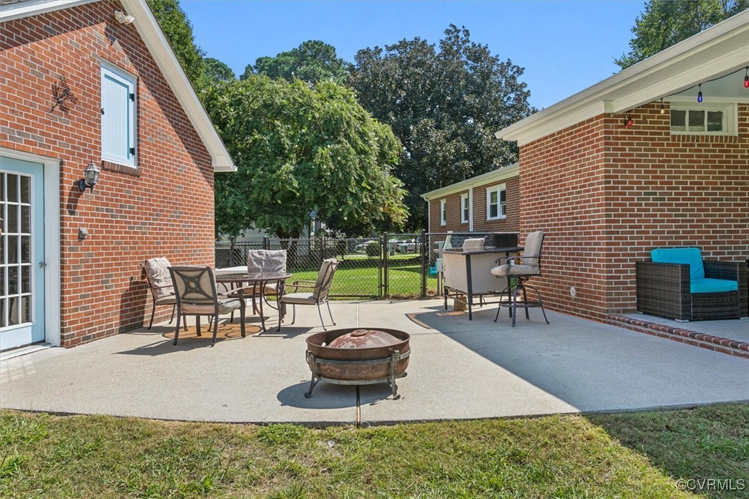 3124 North Riverside Drive Lanexa, VA 23089 - Photo 37 of 50 a view of a backyard with sitting area and fire pit