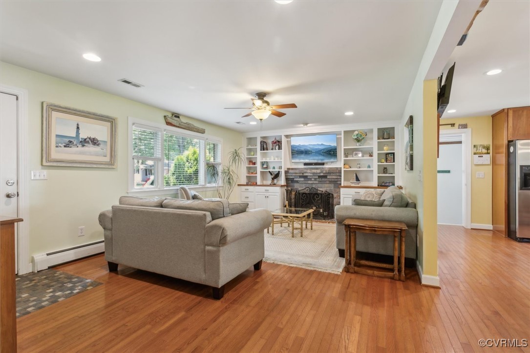 3124 North Riverside Drive Lanexa, VA 23089 - Photo 8 of 50 a living room with furniture and a wooden floor