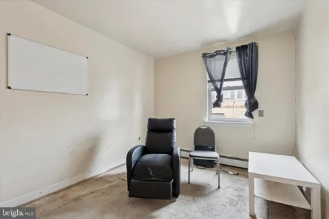 a bedroom with a bed and a sink